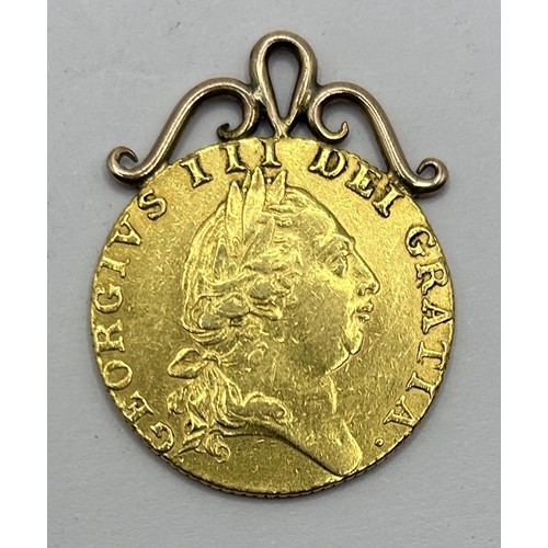 32 - A George III gold spade guinea, 1787, with a later yellow metal mount