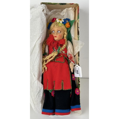 162 - A mid-20th century Continental felt doll, in traditional dress, probably be Lenci, boxed