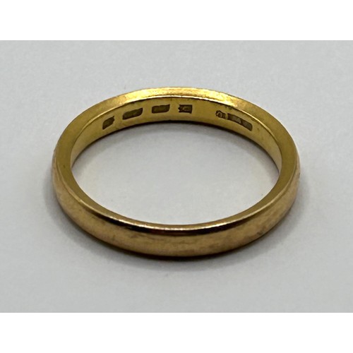 503 - A 22ct gold band, ring size L, 4 g