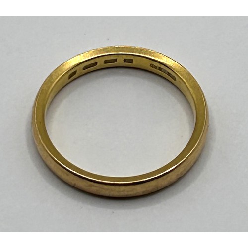 503 - A 22ct gold band, ring size L, 4 g