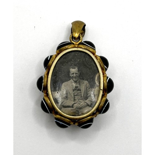 557 - ***On instructions of the family regretfully withdrawn*** A 19th century yellow coloured metal and h... 