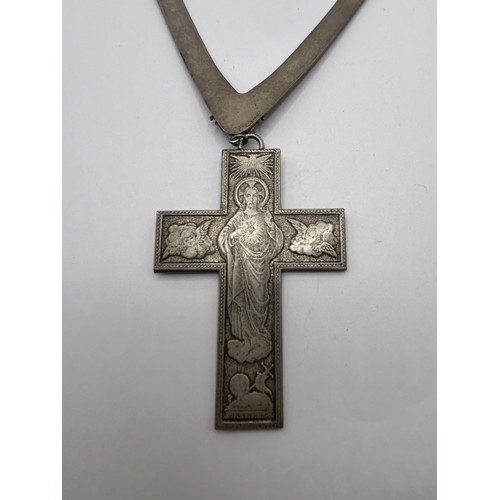 577 - A Jean Paul Gaultier red enamel cross pendant, on a red enamel silver coloured metal necklace