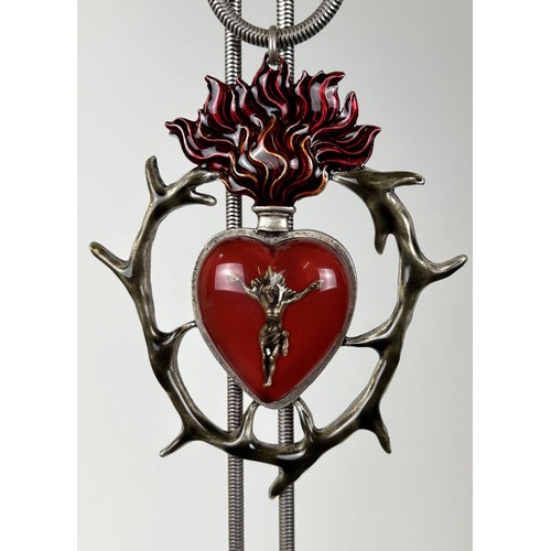 579 - A large Jean Paul Gaultier pendant, of a flaming heart on a chain