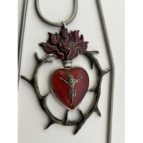 579 - A large Jean Paul Gaultier pendant, of a flaming heart on a chain