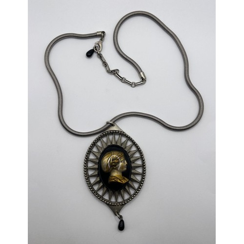 589 - A Jean Paul Gaultier cameo pendant on a chain