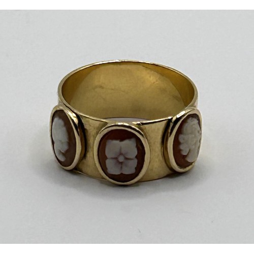 597 - An 18ct gold ring, inset with three oval cameos