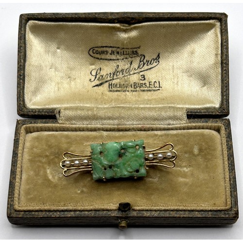 598 - An Art Deco seed pearl and carved green stone bar brooch, in a vintage jewellery box