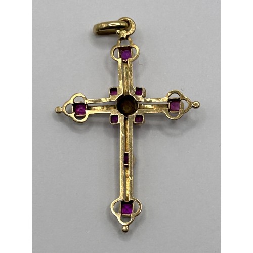 599 - A late 19th/early 20th century gold, cultured pearl and red stone cross pendant