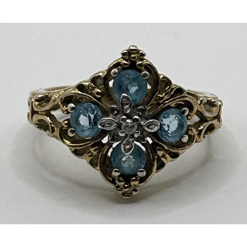 631 - A 9ct gold, aquamarine and diamond cluster ring