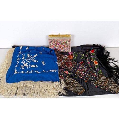 748 - A pair of knitted winter gloves, two embroidered shawls, and a handbag (box)