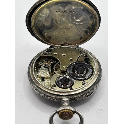 609 - A silver Omega fob watch, with engraved decoration, the enamel dial with Roman numerals, with a chai... 