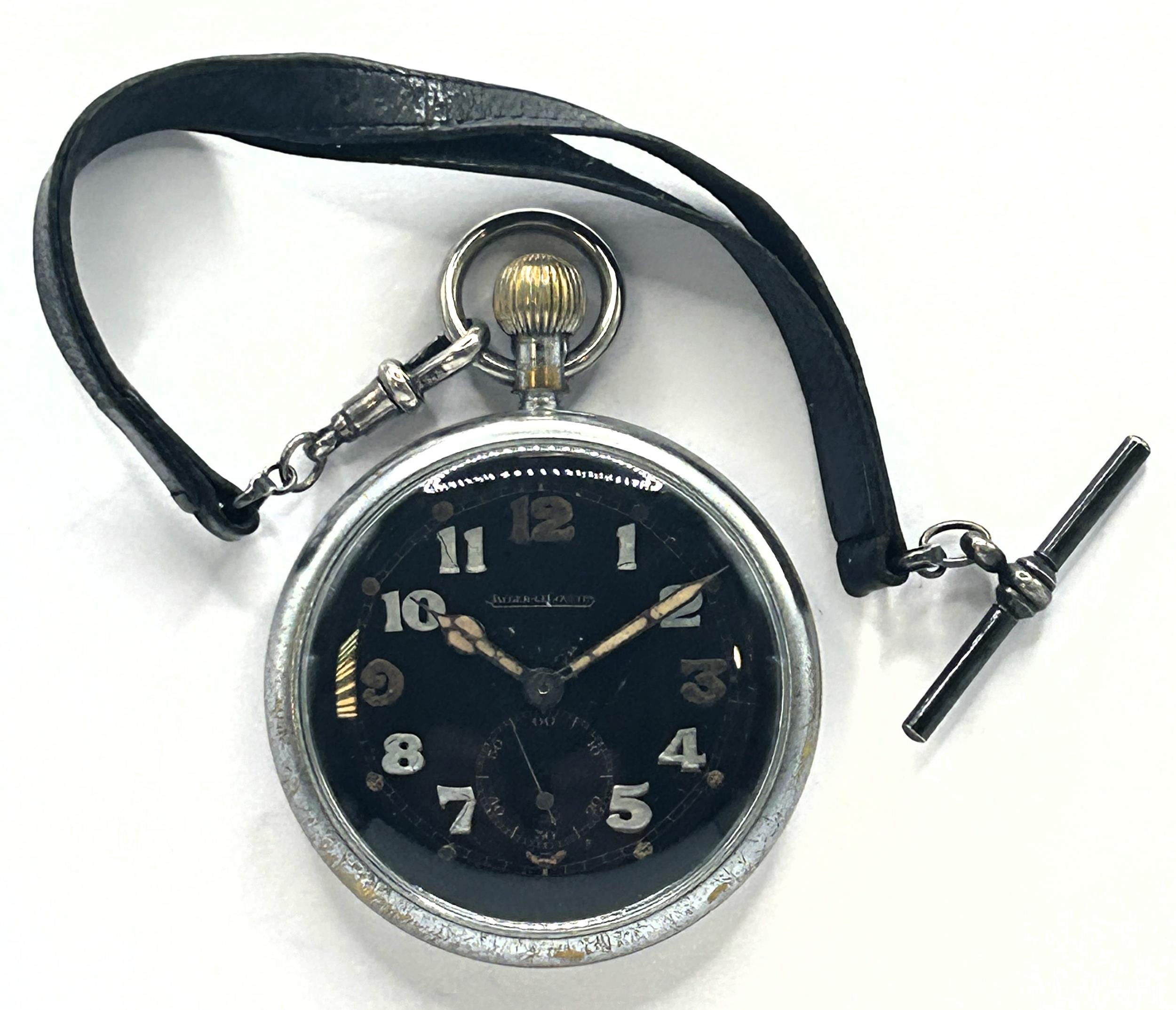 A Jaeger LeCoultre military open face pocket watch the black dial