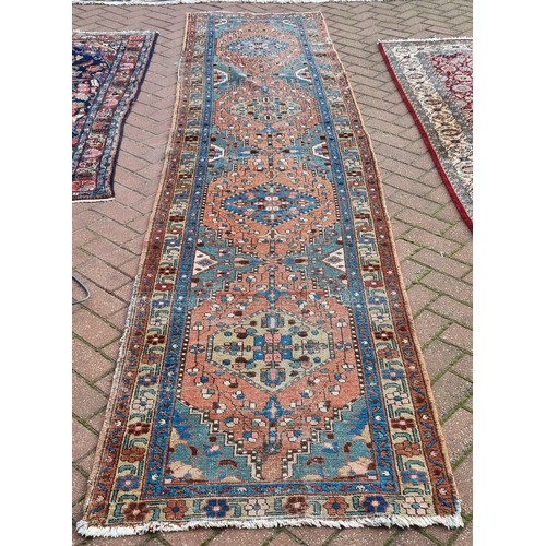 926 - An antique Persian hand-made Heriz runner  383 x 88 cm