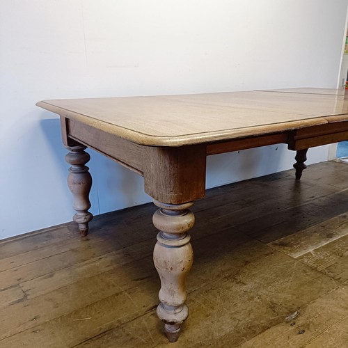 969 - A mahogany extending dining table, on turned legs, the top 106 x 120 cm, with two extra leaves, 60 c... 