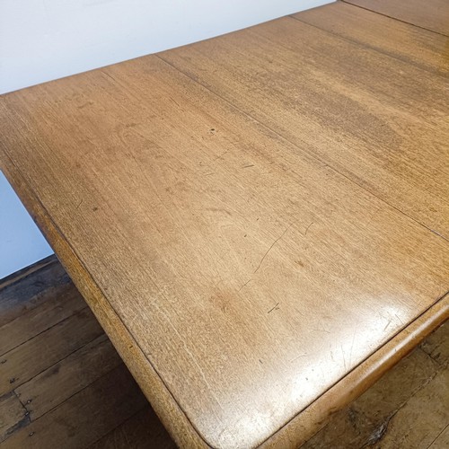 969 - A mahogany extending dining table, on turned legs, the top 106 x 120 cm, with two extra leaves, 60 c... 