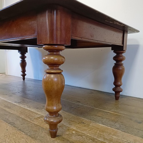 969 - A mahogany extending dining table, on turned legs, the top 106 x 120 cm, with two extra leaves, 60 c... 