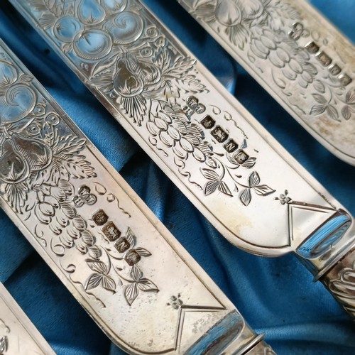 714 - A set of Victorian silver dessert knives and forks, with mother of pearl handles, Sheffield 1880, in... 