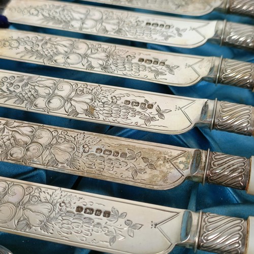 714 - A set of Victorian silver dessert knives and forks, with mother of pearl handles, Sheffield 1880, in... 