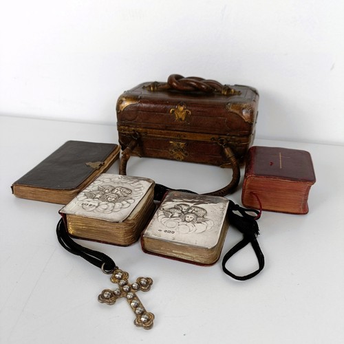 707 - A late Victorian tooled leather box, two silver mounted prayer books, two other prayer books, and a ... 