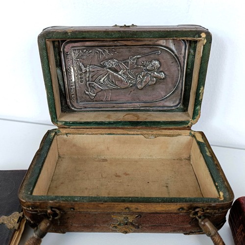 707 - A late Victorian tooled leather box, two silver mounted prayer books, two other prayer books, and a ... 