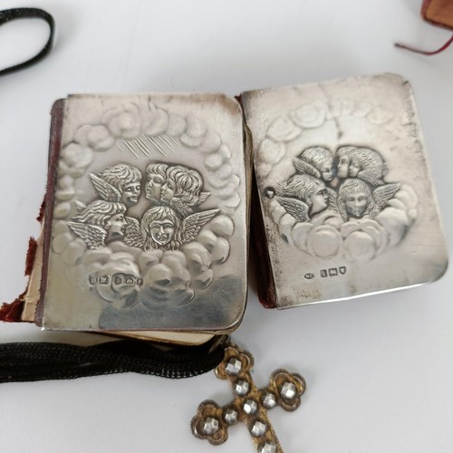 707 - A late Victorian tooled leather box, two silver mounted prayer books, two other prayer books, and a ... 