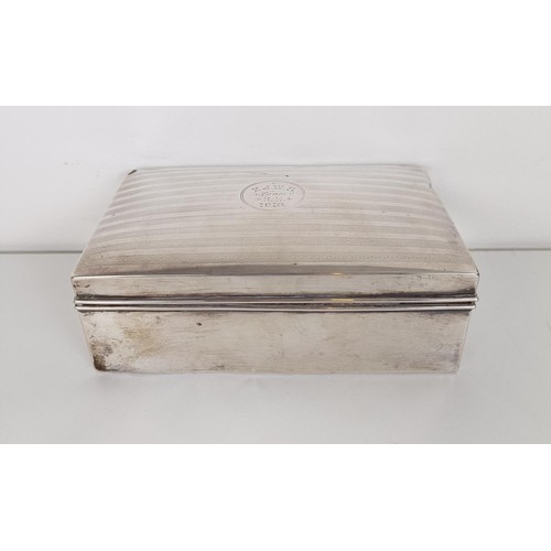 700 - A George V silver cigarette box, 14 cm wide