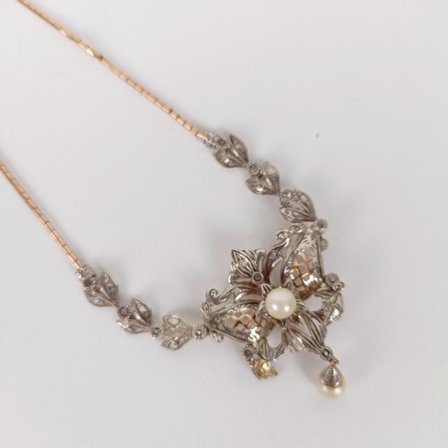 566 - An Art Nouveau style gold, silver and pearl necklace