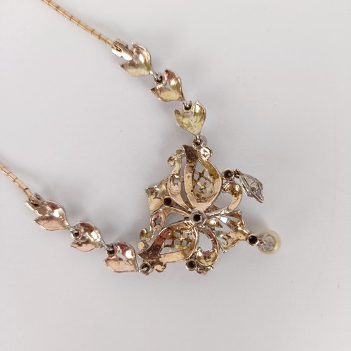 566 - An Art Nouveau style gold, silver and pearl necklace