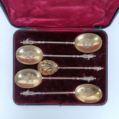 650 - A Victorian silver gilt fruit set, comprising four spoons, and a sifter spoon, with figural handles,... 