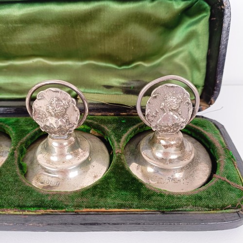 656 - A set of three silver Art Nouveau style menu holders, and another set of three, bases filled, cased