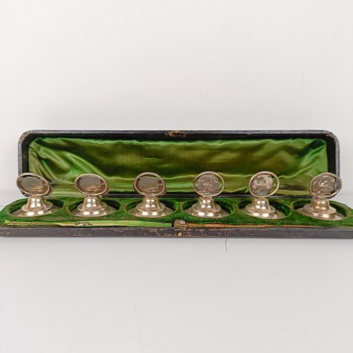 656 - A set of three silver Art Nouveau style menu holders, and another set of three, bases filled, cased