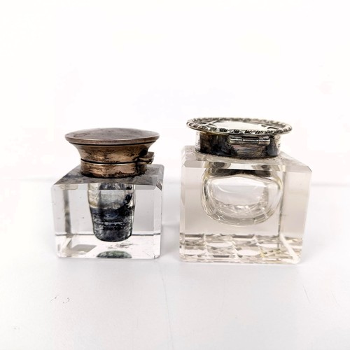 718 - A cut glass inkwell, with a silver mount, and another (2)