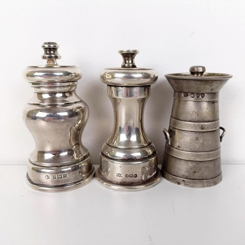 658 - A Victorian silver novelty peppermill in the form of a churn, London 1893, and two silver mounted pe... 