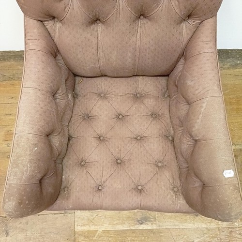 983 - An early 20th century button back library armchair