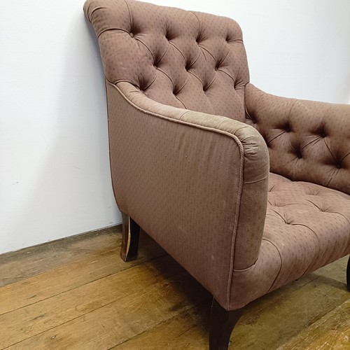 983 - An early 20th century button back library armchair