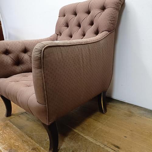 983 - An early 20th century button back library armchair