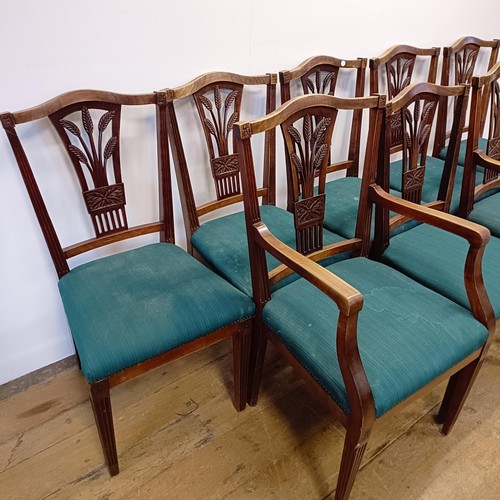 985 - A set of eight camphorwood dining chairs, with pierced splat backs and padded seats (6+2)