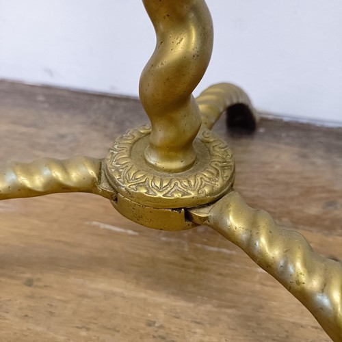 987 - A Dutch brass fire companion set, the stand with a large galleon finial, 120 cm high