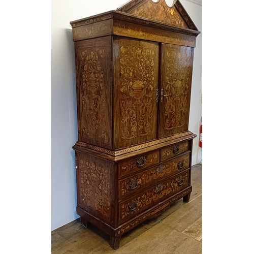 999 - A 19th century Dutch mahogany linen press, with floral marquetry decoration, the two cupboard doors ... 