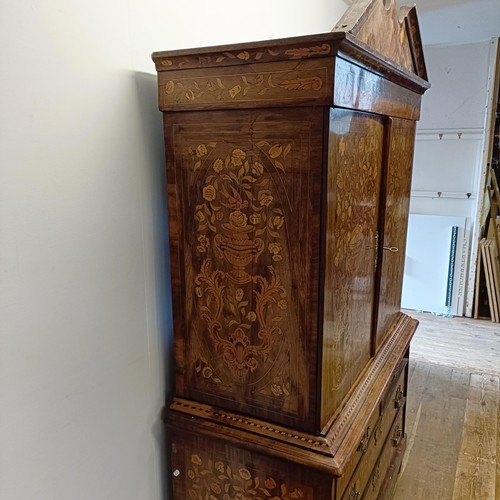 999 - A 19th century Dutch mahogany linen press, with floral marquetry decoration, the two cupboard doors ... 