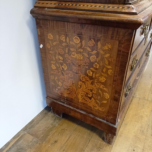 999 - A 19th century Dutch mahogany linen press, with floral marquetry decoration, the two cupboard doors ... 