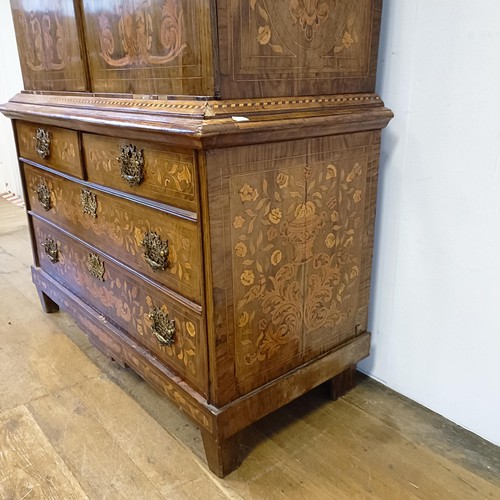 999 - A 19th century Dutch mahogany linen press, with floral marquetry decoration, the two cupboard doors ... 