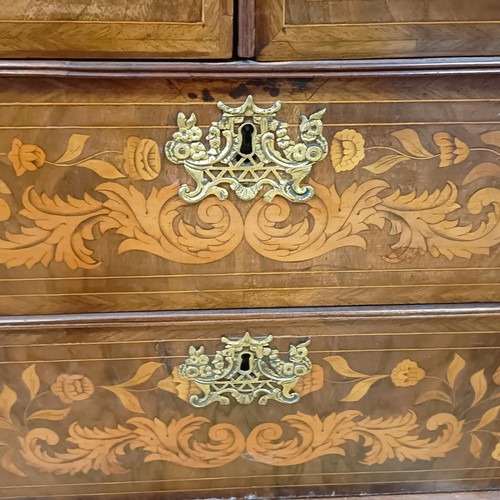 999 - A 19th century Dutch mahogany linen press, with floral marquetry decoration, the two cupboard doors ... 