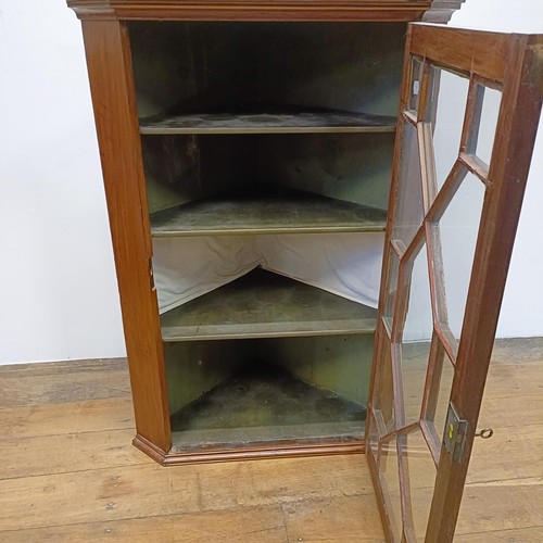 1002 - A mahogany hanging corner cabinet, 70 cm wide