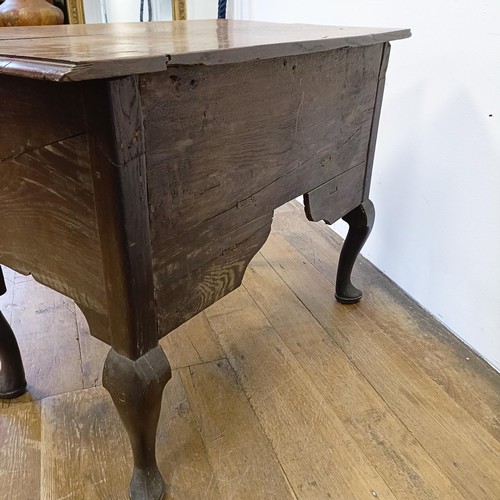 1006 - A 19th century oak lowboy, having four drawers, on cabriole legs, 89 cm wide