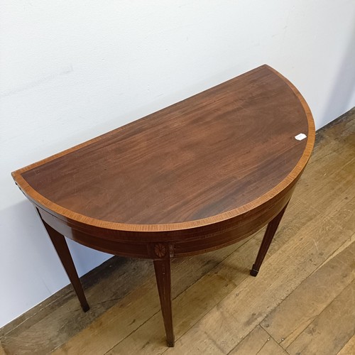 1007 - An inlaid mahogany demi-lune card table, 90 cm wide