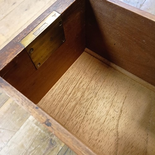 1014 - A mahogany pedestal desk, of small proportions, with an inset top above nine drawers, 92 cm wide