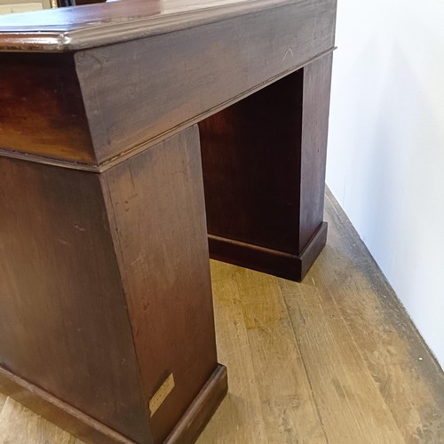 1014 - A mahogany pedestal desk, of small proportions, with an inset top above nine drawers, 92 cm wide