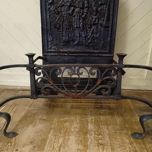 1017 - A late 19th/early 20th century cast iron fire basket, with a raised back decorated figures, 95 cm wi... 