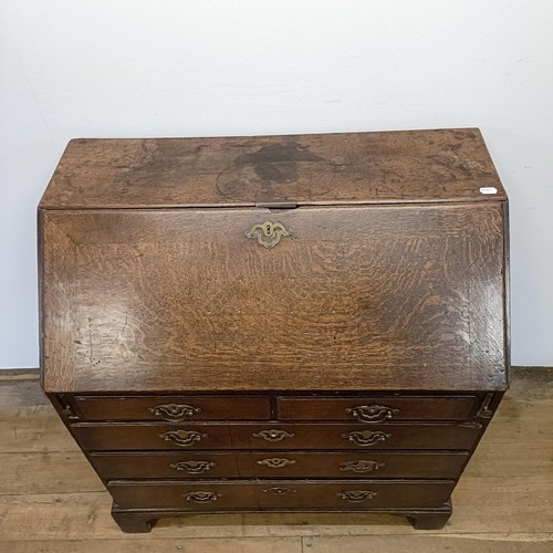 1020 - A 18th century oak bureau, with original handles, 92 cm wide